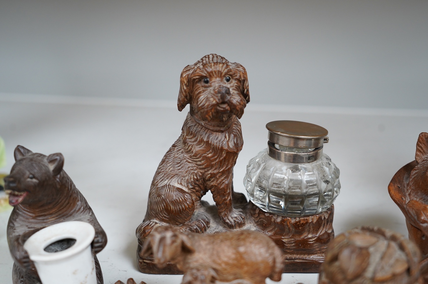 A collection of five carved wooden novelty animal inkwells, four black forest, tallest dog inkwell 15cm high. Condition - some small chips but fair